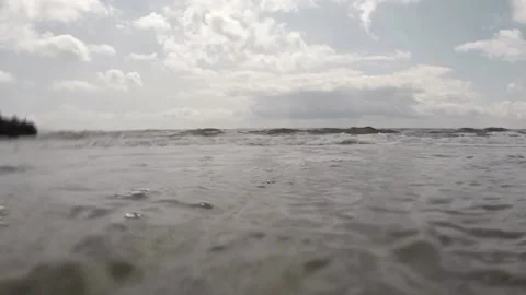 Low Angle Tide Hitting the Lens Stock Footage 231272962
