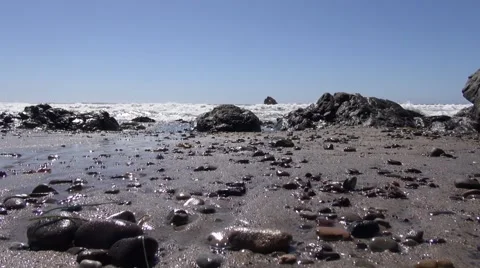 Low angle of tides and water receding at the beach Video stock 40136510