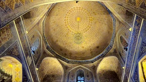 Low angle tilt up of golden interior dome in Gur-e-Amir Mausoleum Stock-Footage 336188046