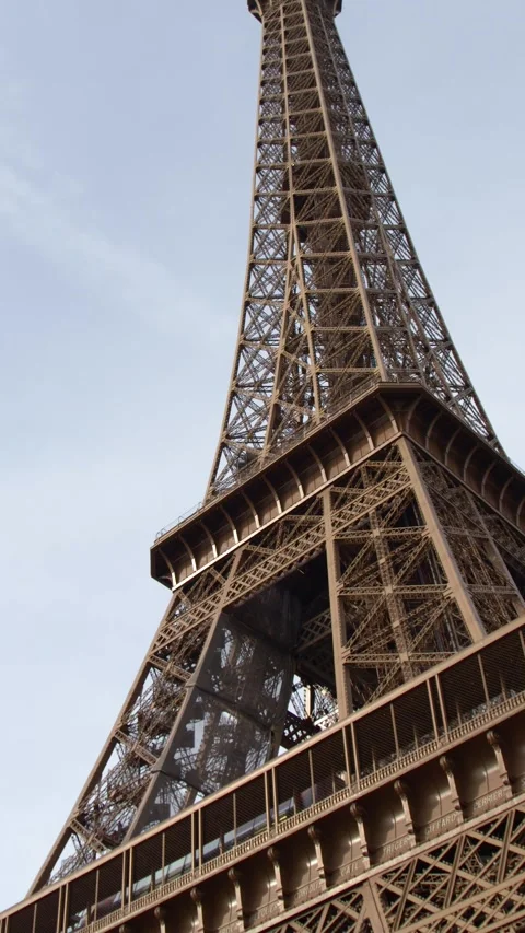 Low Angle Tilt Up the Iconic Eiffel Tower in Paris France Stock Footage 334829102