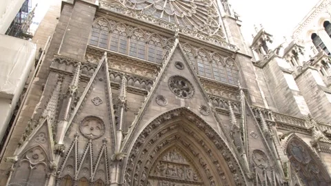 Low Angle Tilt Up of Notre Dame Cathedral Facade in Paris Video stock 344942720