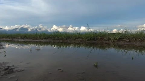 Low angle time lapse of clouds rolling over Alps mountains Stock Footage 132337782