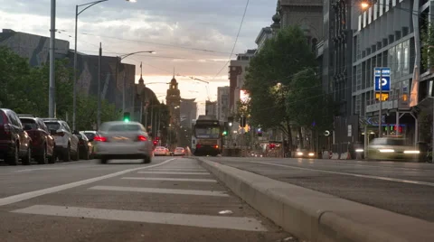 A low angle time lapse shot of the traffic in Melbourne cbd at dusk in 4K Stock Footage 62090958