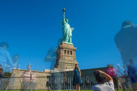 Low Angle Time Lapse of the Statue of Liberty with Bustling Activity Stock Footage 123396188