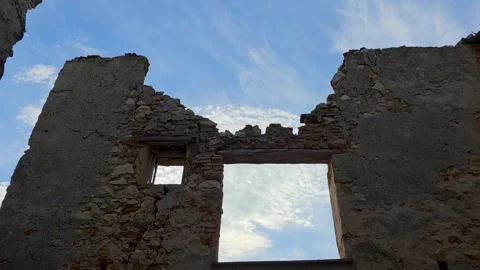 Low angle timelapse of cirrus clouds moving fast over ancient stone wall rui Stock Footage 344908296