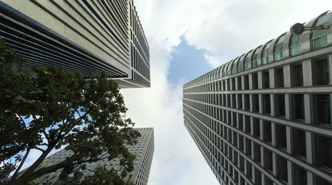 Low angle timelapse of cloudscape between buildings. Stock Footage 61511343