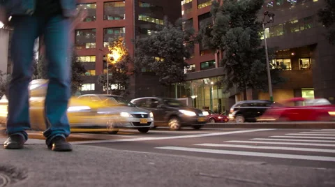 Low angle timelapse of pedestrians and vehicles at an intersection Stock Footage 41894798