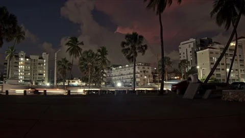 Low angle timelapse of Santo Domingo City with car traffic. Cloudscape and Stock Footage 232971946