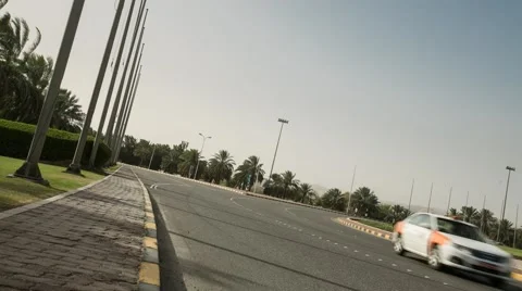 Low Angle Timelapse on the sidewalk of a roundabout in Muscat Stock Footage 44722018