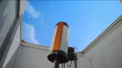 Low angle timelapse of a white telescope pointing at a blue sky with fast clouds Stock Footage 340283643