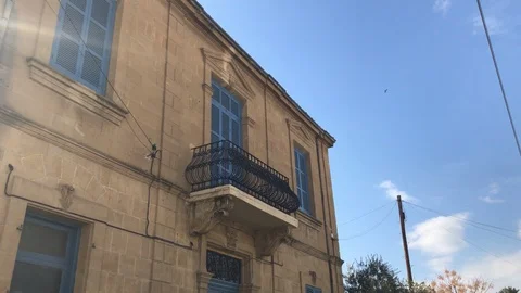 Low Angle Tracking Shot of Classic House Balcony Stock Footage 101070021