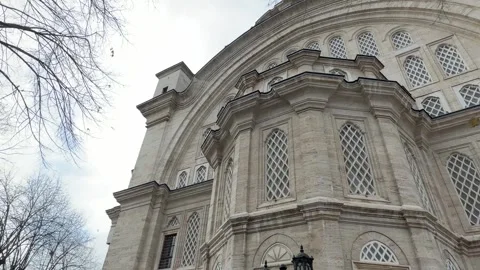 Low angle tracking shot facade and stone lattice windows of a Ottoman Vídeos de archivo 340154867