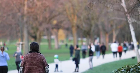 Low Angle Tracking Shot of Male Female Kids Feets in the Park Stock Footage 126756484