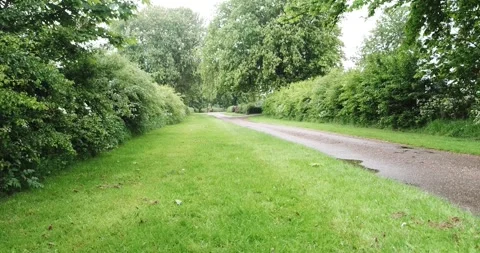 Low angle tracking/drone shot shot of a motorbike rider in the countryside. 库存影片 242584047