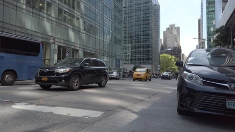 Low Angle Traffic Passing By in Midtown Manhattan Stock Footage 111219933