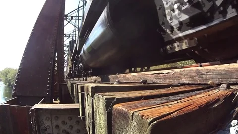 Low Angle Train Pass by on Bridge Stock Footage 74901277