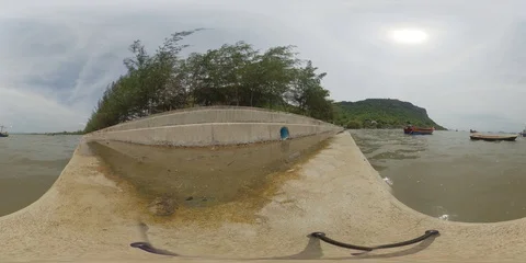 Low angle tranquil shore, moored boats and green mountain - 360 VR Stock Footage 119445662