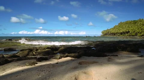 Low angle tropical beach with white sand, palm trees and some stones panorama Stock Footage 67441746