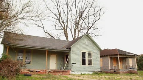 Low angle of two abandoned homes in Clarksdale, MS Video stock 58163432