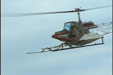 Low Angle Under Crop Dusting AG Helicopter Farming Agriculture Stock Footage 160158