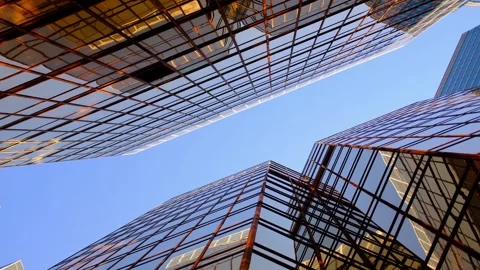 Low angle upward view of blue glass skyscrapers 스톡 동영상 330935126