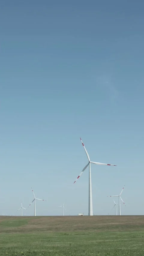 Low angle vertical full shot of windmill field Stock Footage 238009607