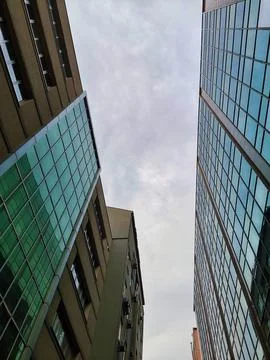 Low angle vertical perspective of modern urban office buildings featuring Fotos de archivo