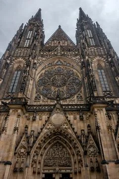 Low angle vertical shot of gothic St. Vitus cathedral in the city of Prague Stock Photos