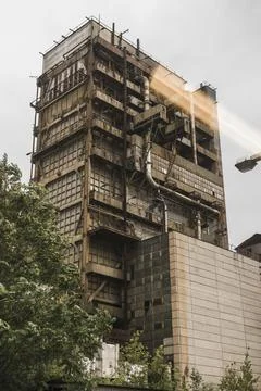 Low angle vertical view of abandoned industrial factory building in Hungary Stock Photos