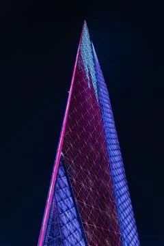 Low Angle Vertical View of Al Mana Tower Displaying Qatari Flag Pattern  Stockfoto's