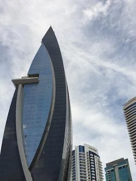 Low angle vertical view of modern glass skyscraper Stock Photos