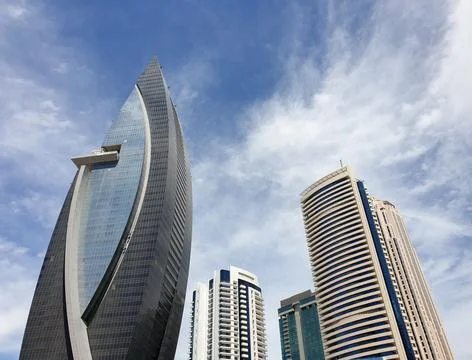 Low angle vertical view of modern glass skyscraper Stock Photos