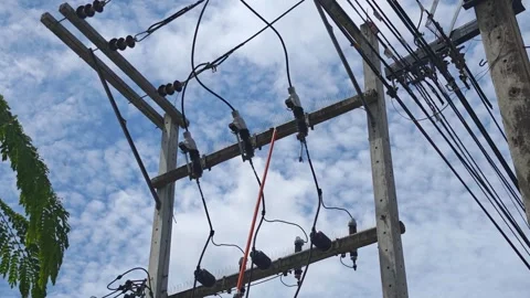 Low angle video of operating an insulated hot stick tool to disconnect. Stock Footage 338194866