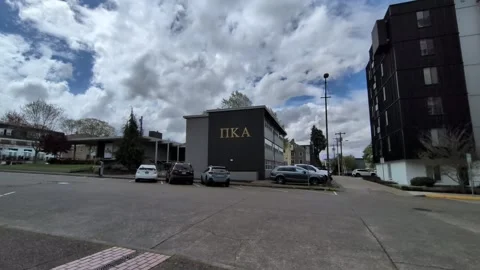 Low-angle video perspective of Pi Kappa Alpha fraternity building Stock Footage 344450367
