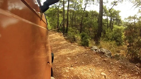 Low angle video of a vintage van travelling on a dirt road Stock Footage 105207160