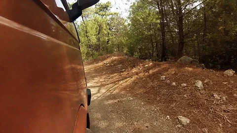 Low angle video of a vintage van travelling on a dirt road Stock Footage 105207164