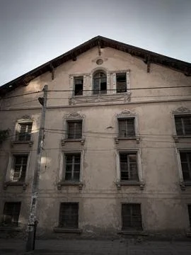 Low angle view of an abounded old house. Beautiful architecture in bad condition Stock Photos