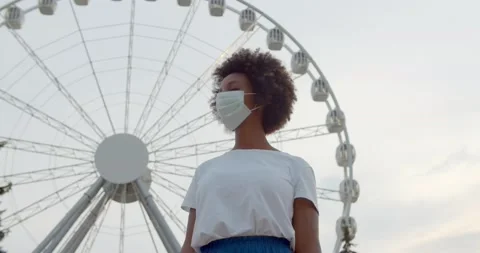 Low angle view of African-American-American young female wearing safety mask in Stock Footage 159819091