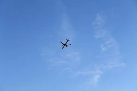 Low angle view of airplane against the sky with space for text Stock Photos