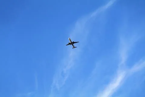 Low angle view of airplane against the sky with space for text Stock Photos