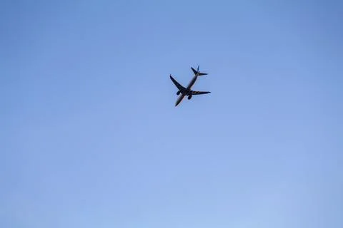 Low angle view of airplane against the sky with space for text Stock Photos