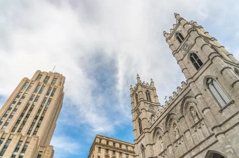 Low angle view of Aldred Building and Notre-Dame Basilica of Montreal Stock Photos