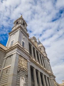 Low angle view of Almudena Cathedral towers against blue sky Stock Photos