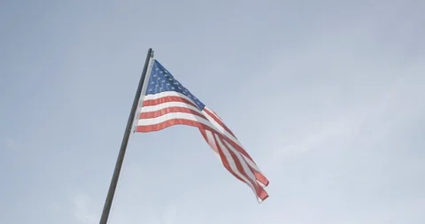Low angle view of American flag waving in the air at dusk Stock Footage 145280098