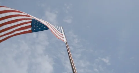 Low angle view of American flag waving in the air at dusk Stock Footage 145280143