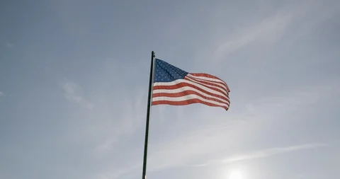 Low angle view of American flag waving in the air at dusk Stock Footage 145280175