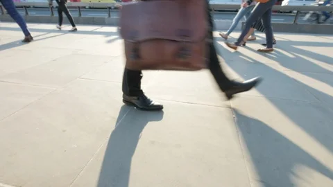 Low angle view of anonymous commuters legs at rush hour Video stock 88716565