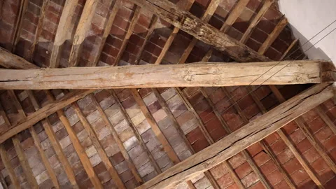 Low angle view of antique ceiling made of wooden planks and red bricks Video stock 317404220