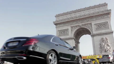 Low Angle View of the Arc de Triomphe with City Traffic and Blurred Cars - 4K Stock Footage 333547622