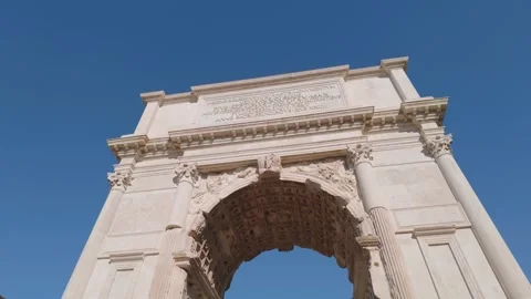 Low Angle View of the Arch of Titus Framed by Tree Branches in Rome, Italy Stock-Footage 338393896